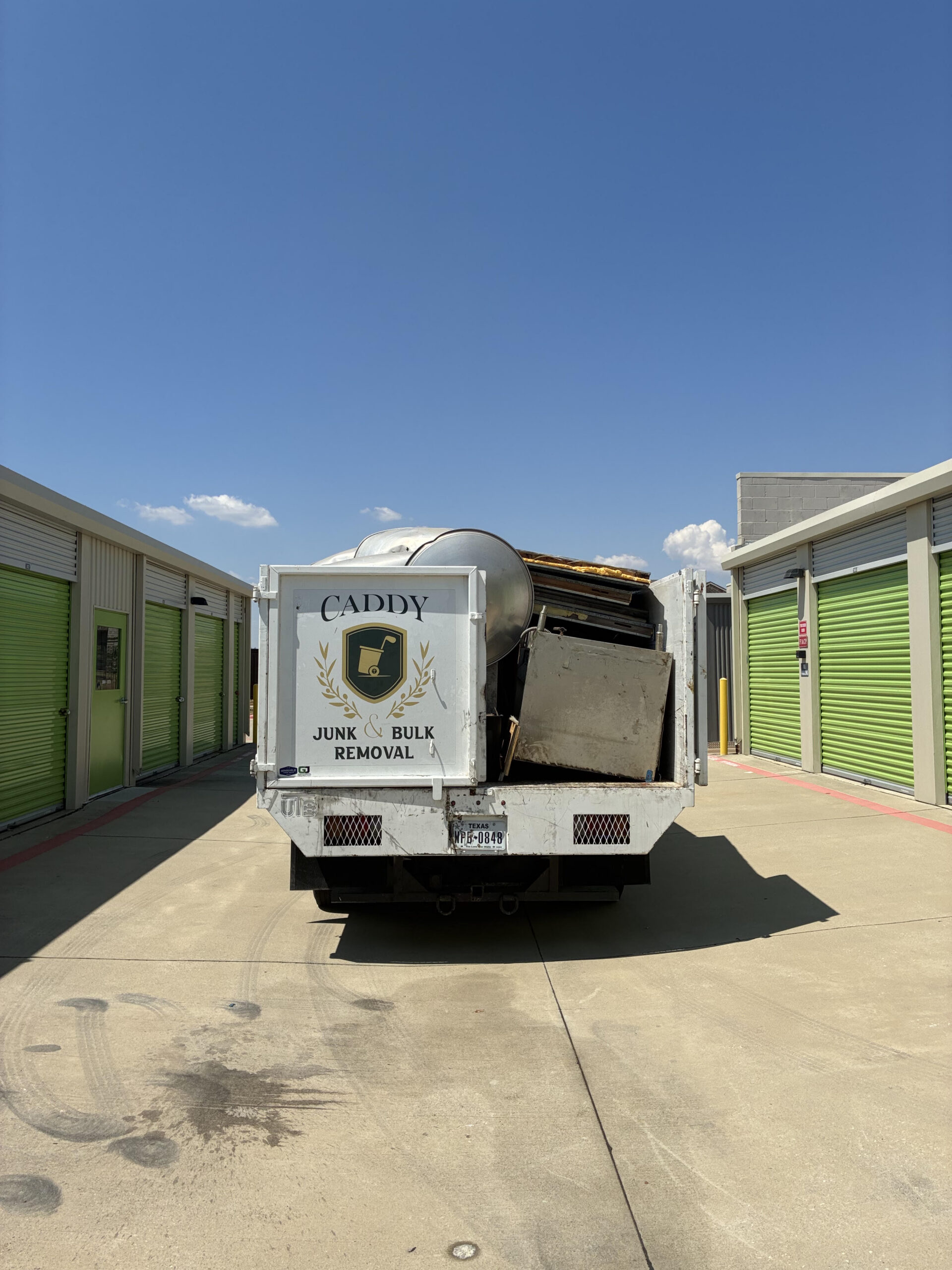 Storage Unit full of old heavy kitchen equipment cleared and disposed of for Tender Smokehouse